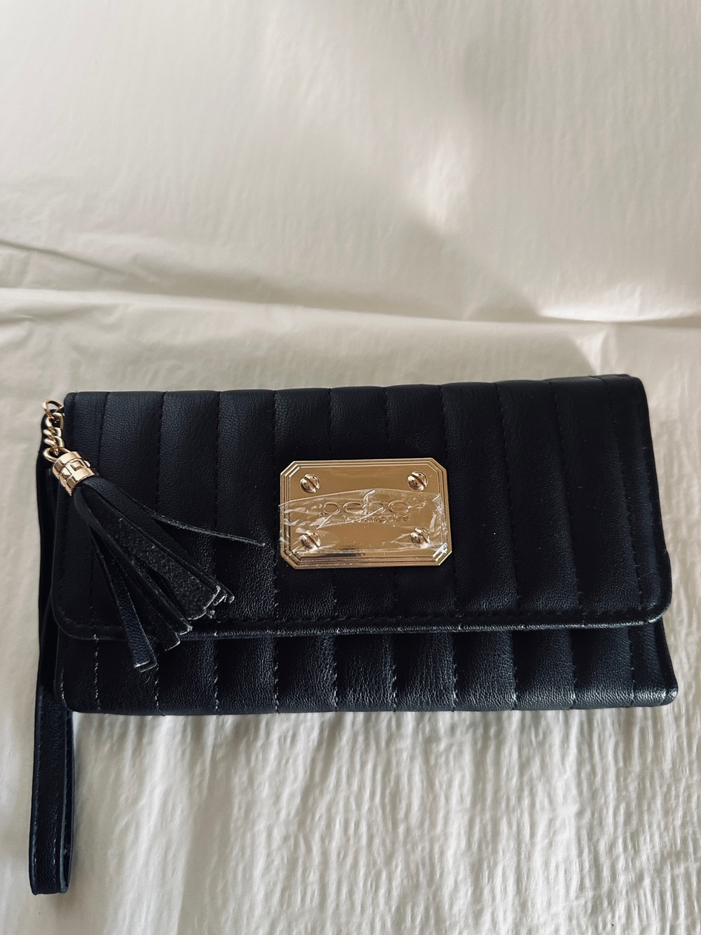 bebe Black Quilted Wristlet Clutch with Gold Plaque & Tassel Vegan Leather NWOT